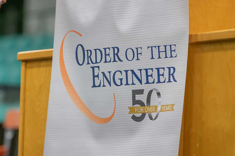 Order of the Engineer Banner on a podium