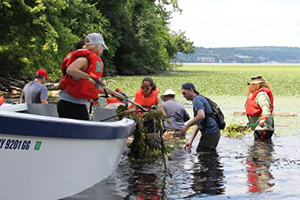 Students and Professor Shane Rogers doing research in the water with Beacon Institute.
