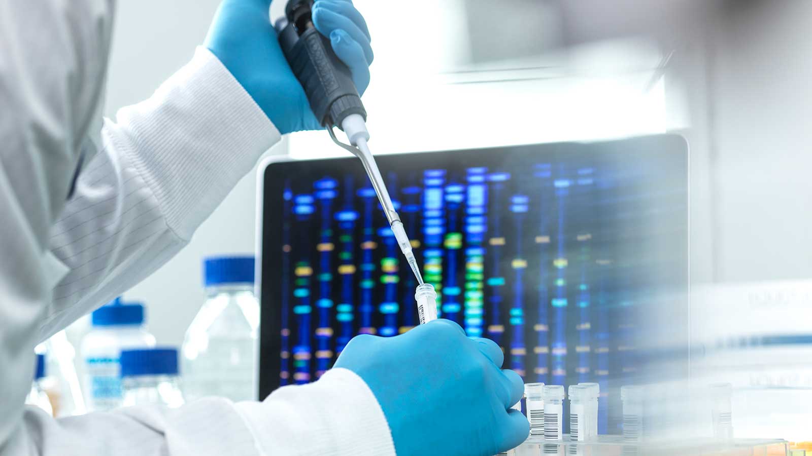 Researcher using a pipette in a lab representing Science Studies at Clarkson Univeristy