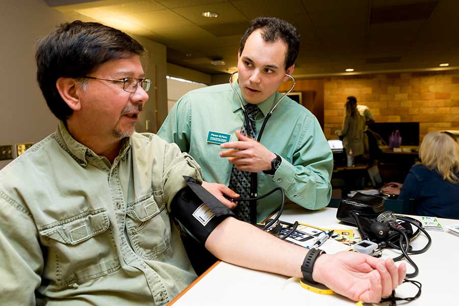 Employee having their blood pressure checked