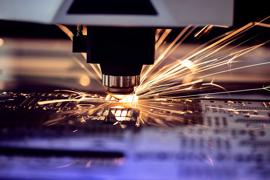 Industrial laser machine cuts out parts in sheet steel