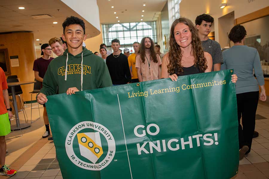 Students holding Go Knights! banner for freshman convocation