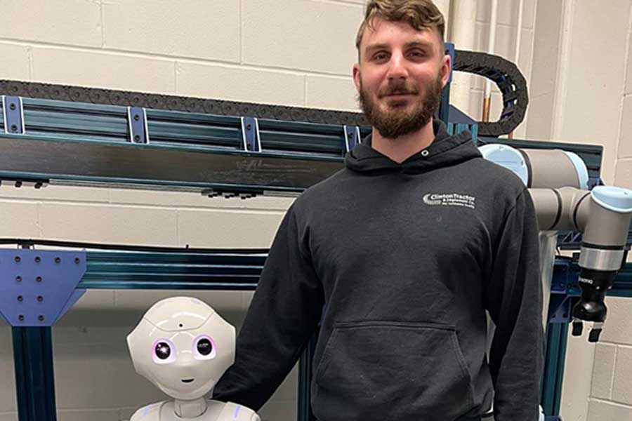 Student with an assistive robot