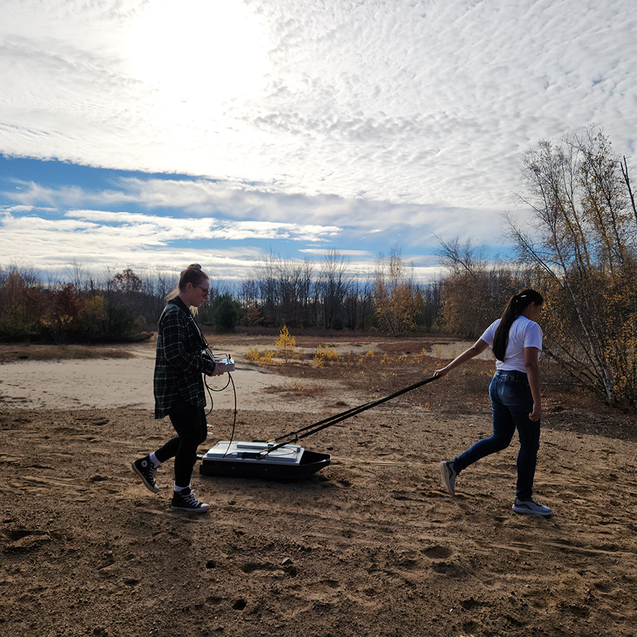 Gladys Pantoja, a Clarkson University PhD student, tows a GPR in Potsdam to explore ancient sand dunes which are remnants of the prehistoric Champlain Sea coastline.
