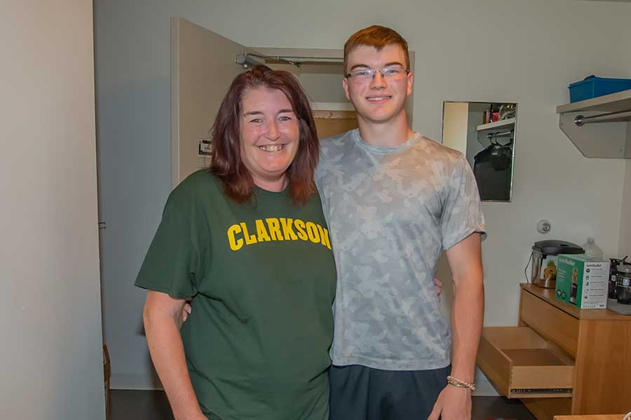 A mother and her son in his dorm after move in
