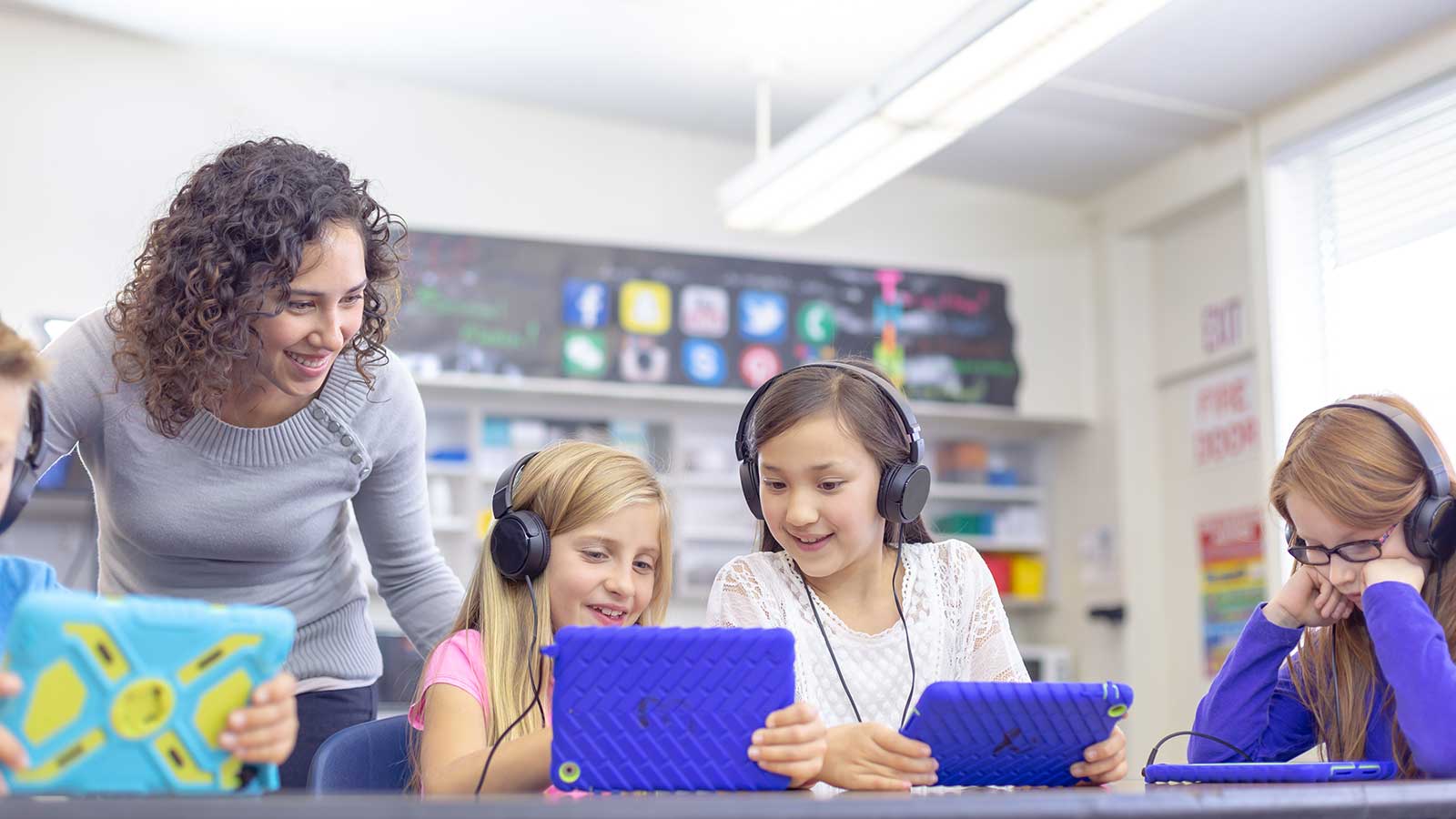 Students working with a teacher