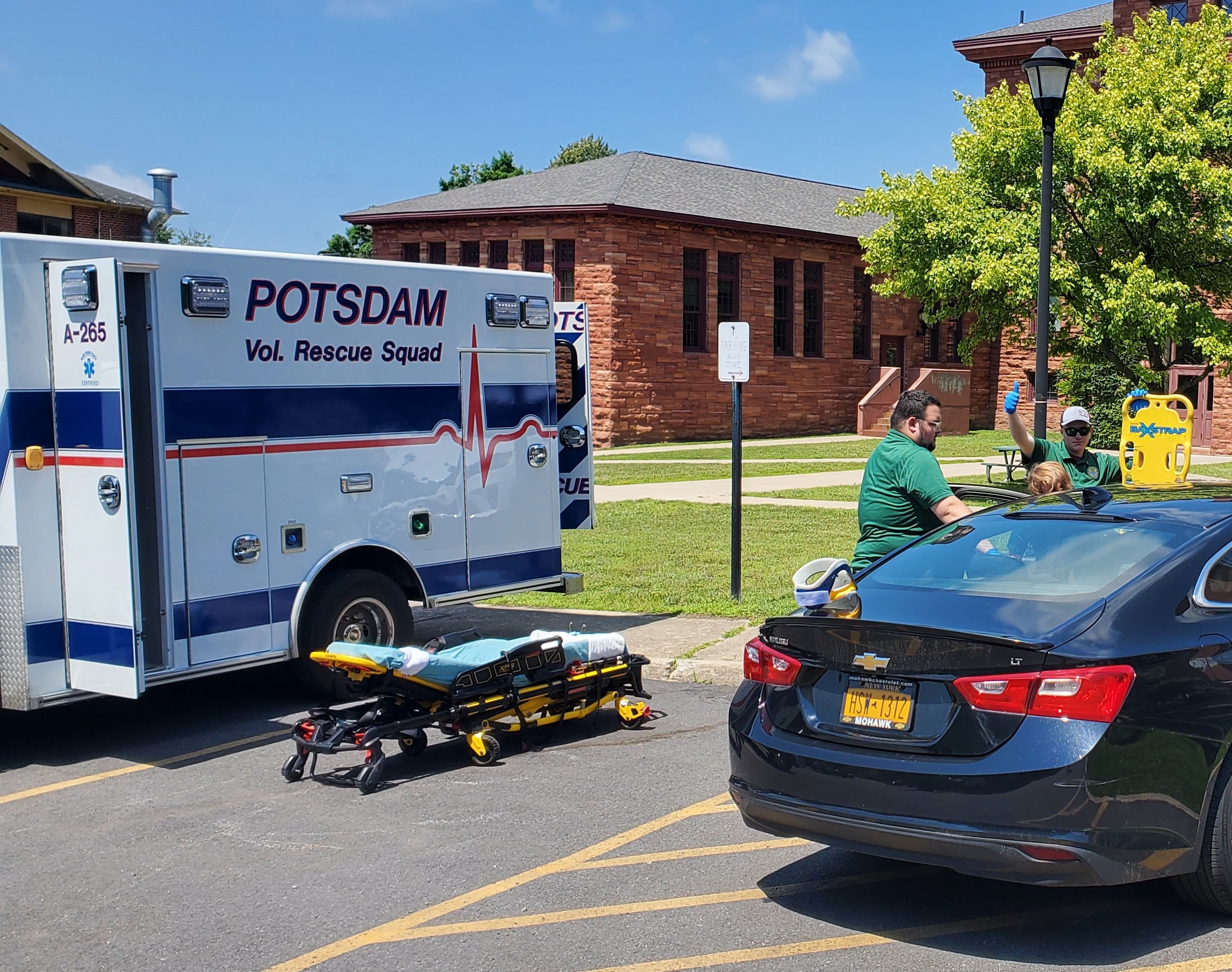 Potsdam rescue ambulance and car parked outside Clarkson's Old Main Hall