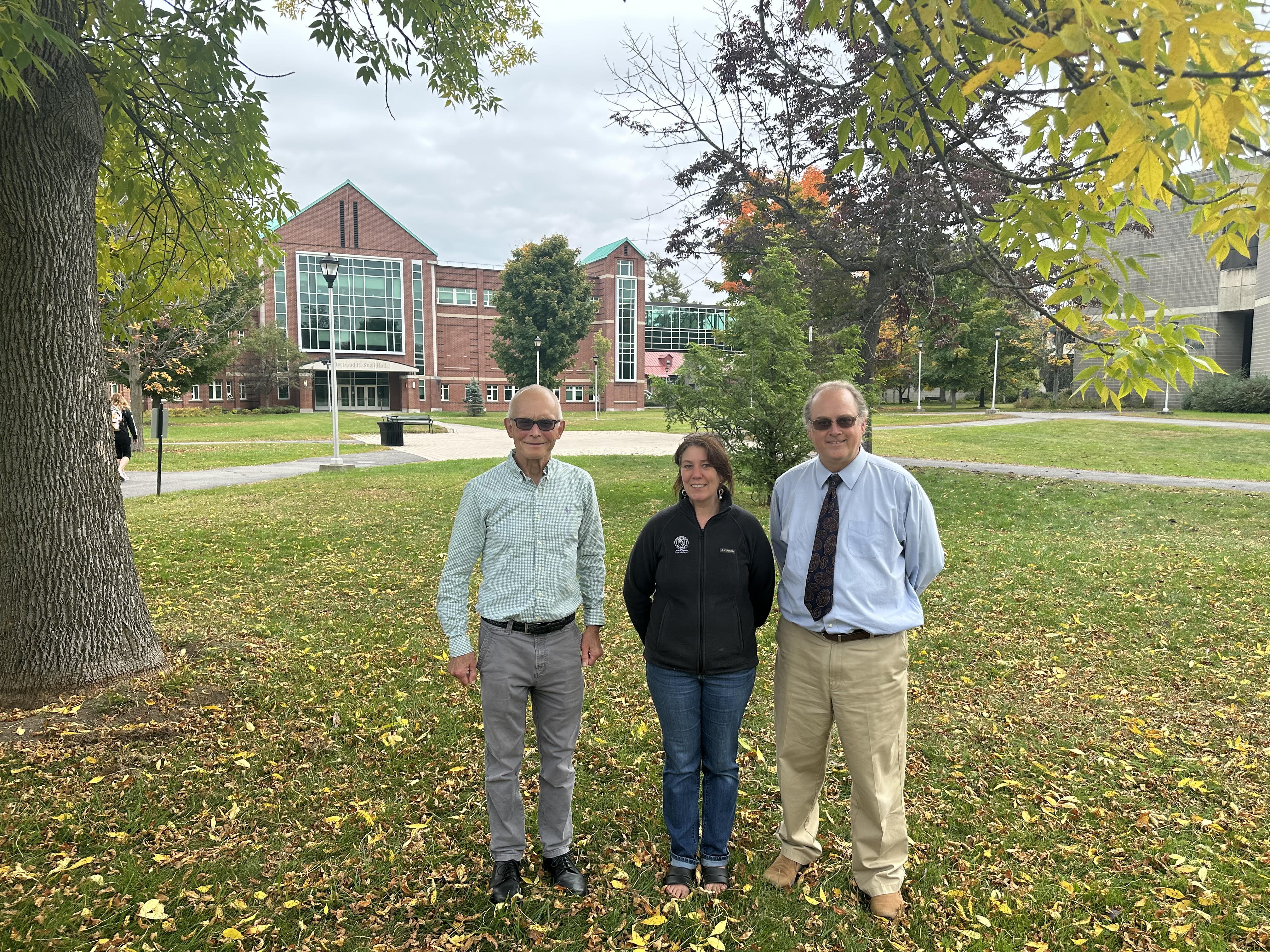 Portrait of Robert Dowman, Katie Kavanagh and Lennart Johns outside Snell Hall on the Clarkson University Collins Hill Campus