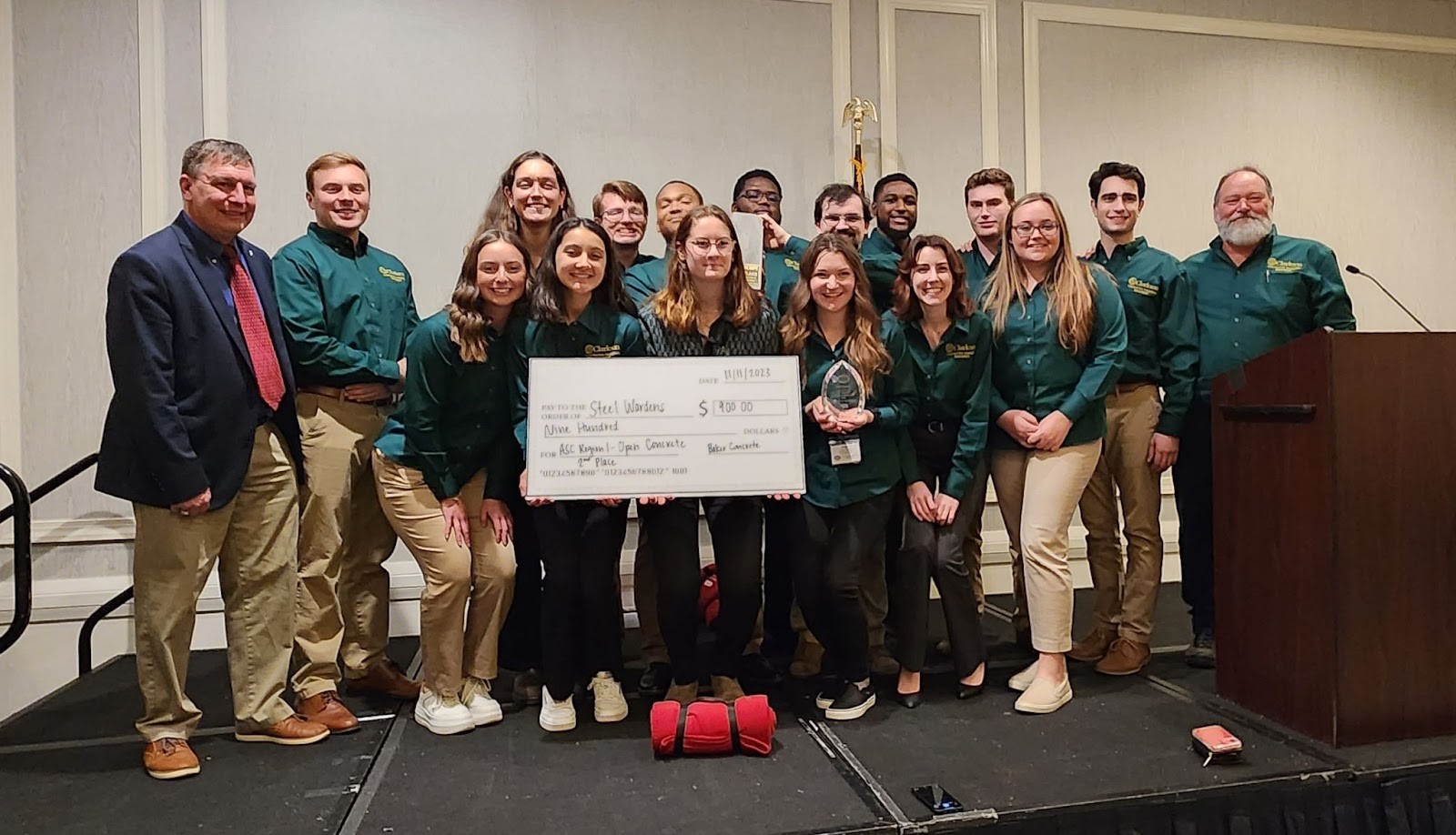 Students from Clarkson University’s Construction Engineering Management (CEM) Program, Student Projects in Engineering Experience and Design (SPEED) teams pose with prize money checkce