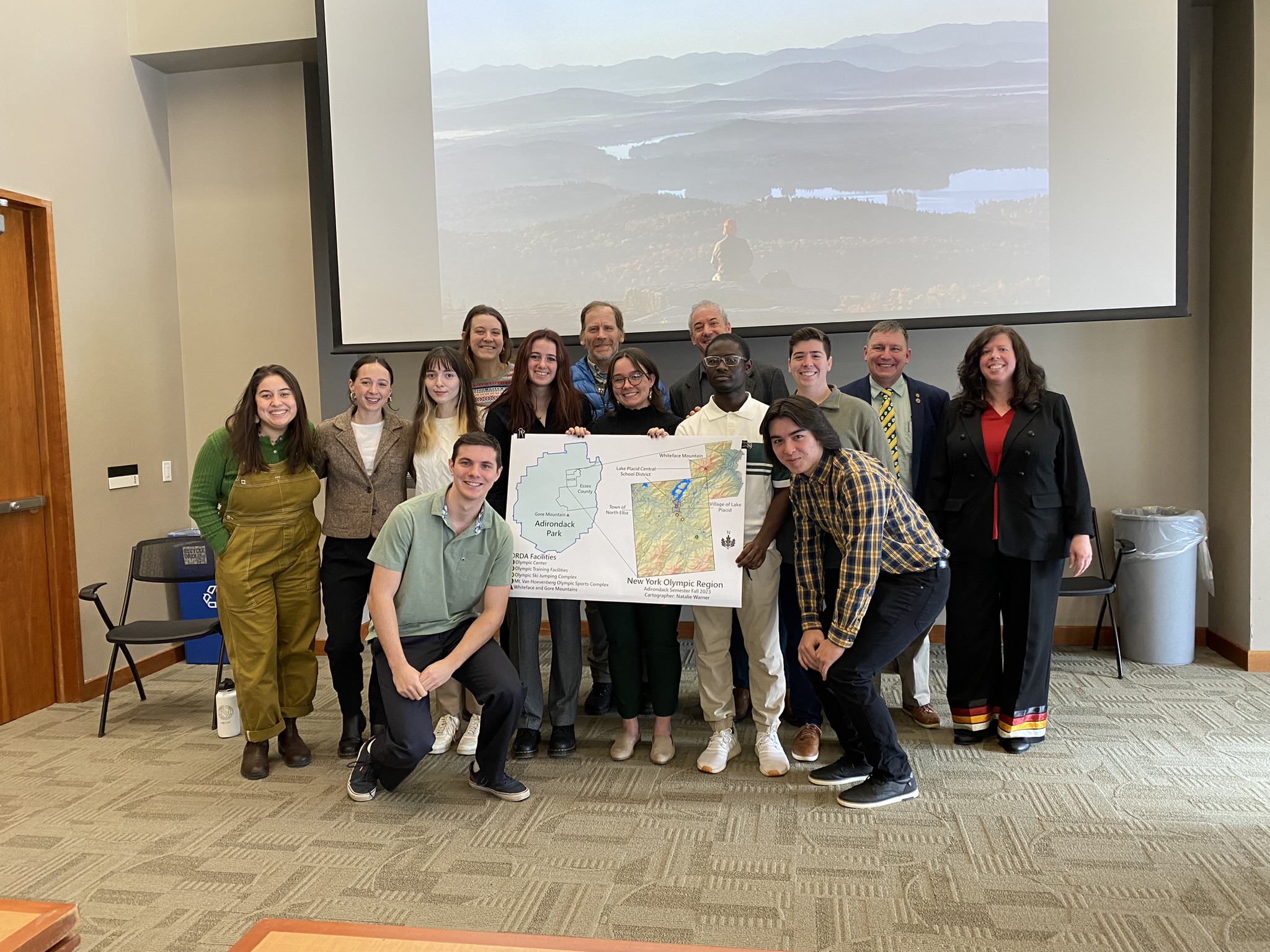 Students from Clarkson's Adirondack Semester pose for a photo to display a research poster on the Clarkson University campus
