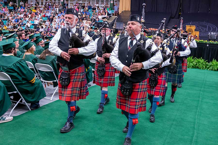 Bagpipers ushering the graduating class into the ceremony