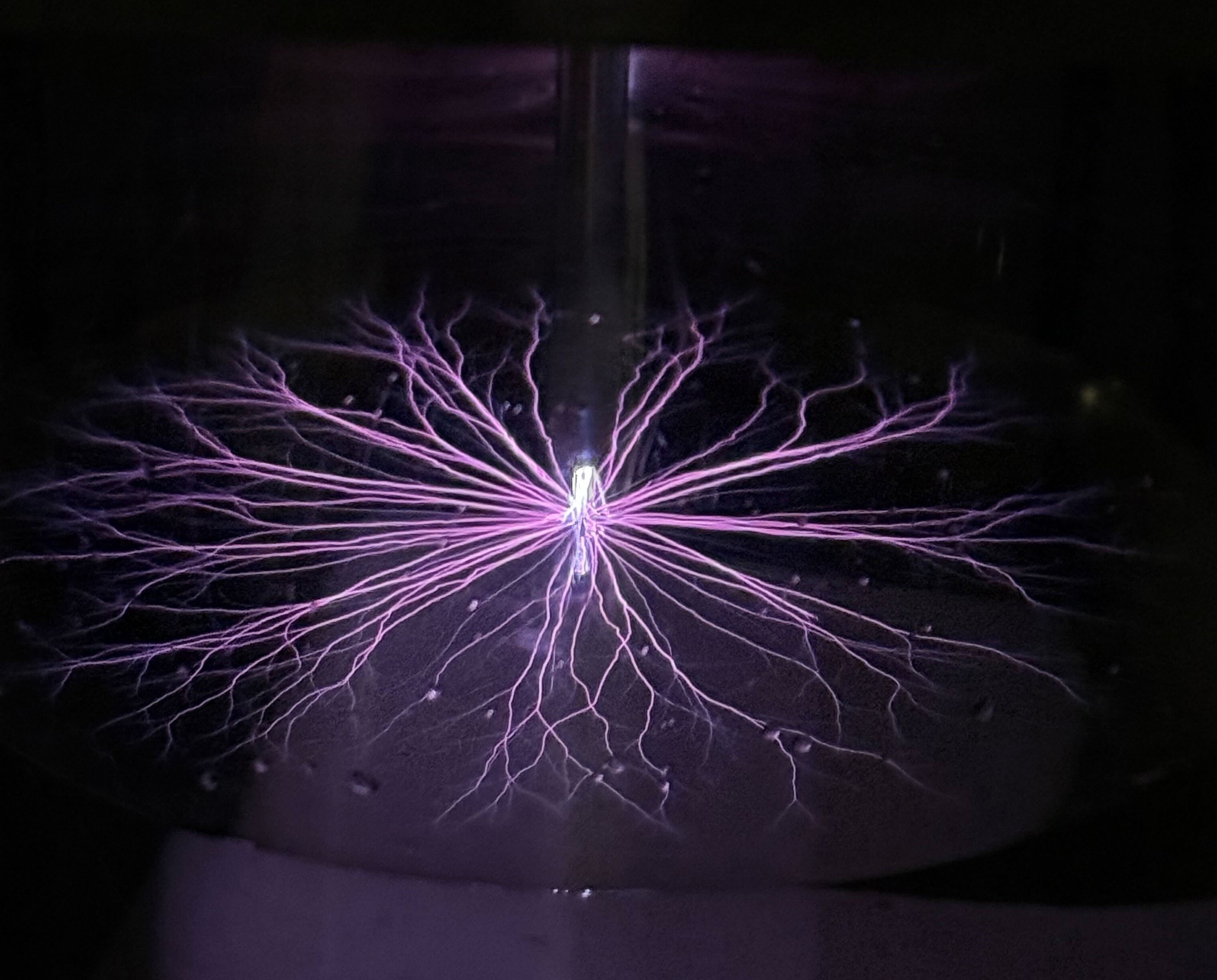 A plasma web spans through a darkened background