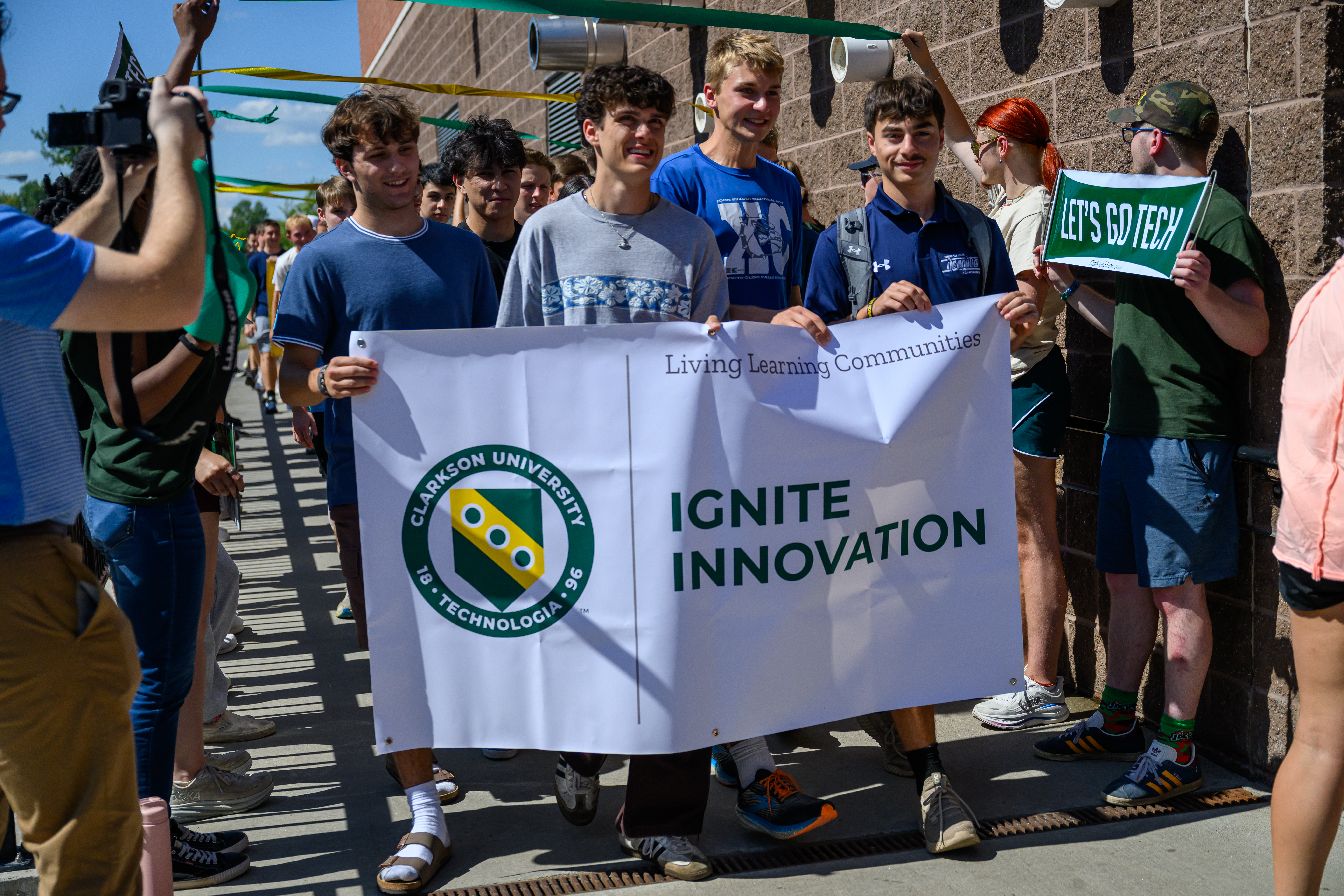 Ignite Innovation Banner held by students, in the year 2025
