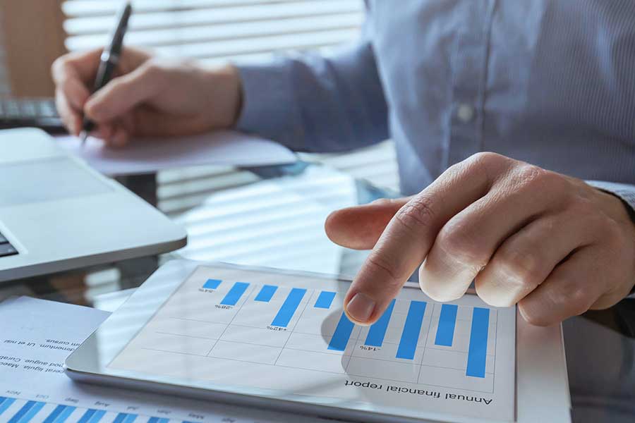 individual working on spreadsheets