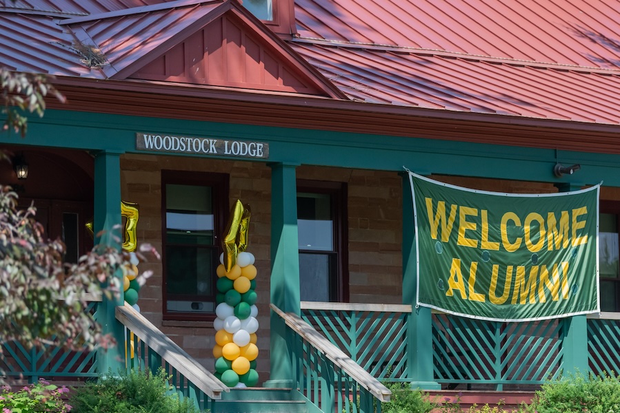 Woodstock Lodge Building with a Banner that says Welcome Alumni
